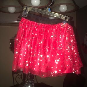 Girls skirt, worn once. Red with silver stars. Size 6/6X